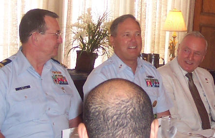 BG Merion (far right), Member of the Armed Services Committee of the Union League, listens