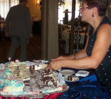 Cutting the cake at the Coast Guard Birthday event